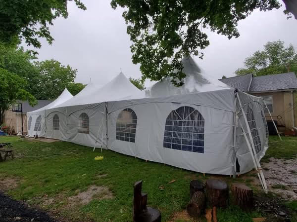 White event tent with side walls and arched windows